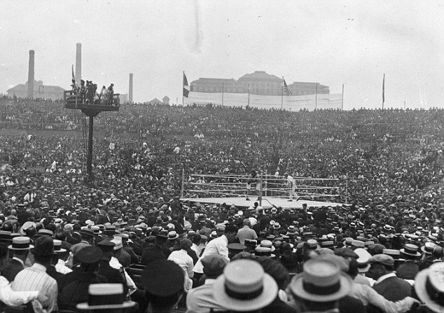 2nd July 1921: A general view of the crowd watching the world heavyweight title fight between the current champion Jack Dempsey of the USA and French contender Georges Carpentier at Boyle's Thirty Acres in Jersey City, New Jersey. Dempsey retained his title with a fourth round knockout. The fight drew the first-ever million-dollar gate. (Photo by Topical Press Agency/Getty Images)