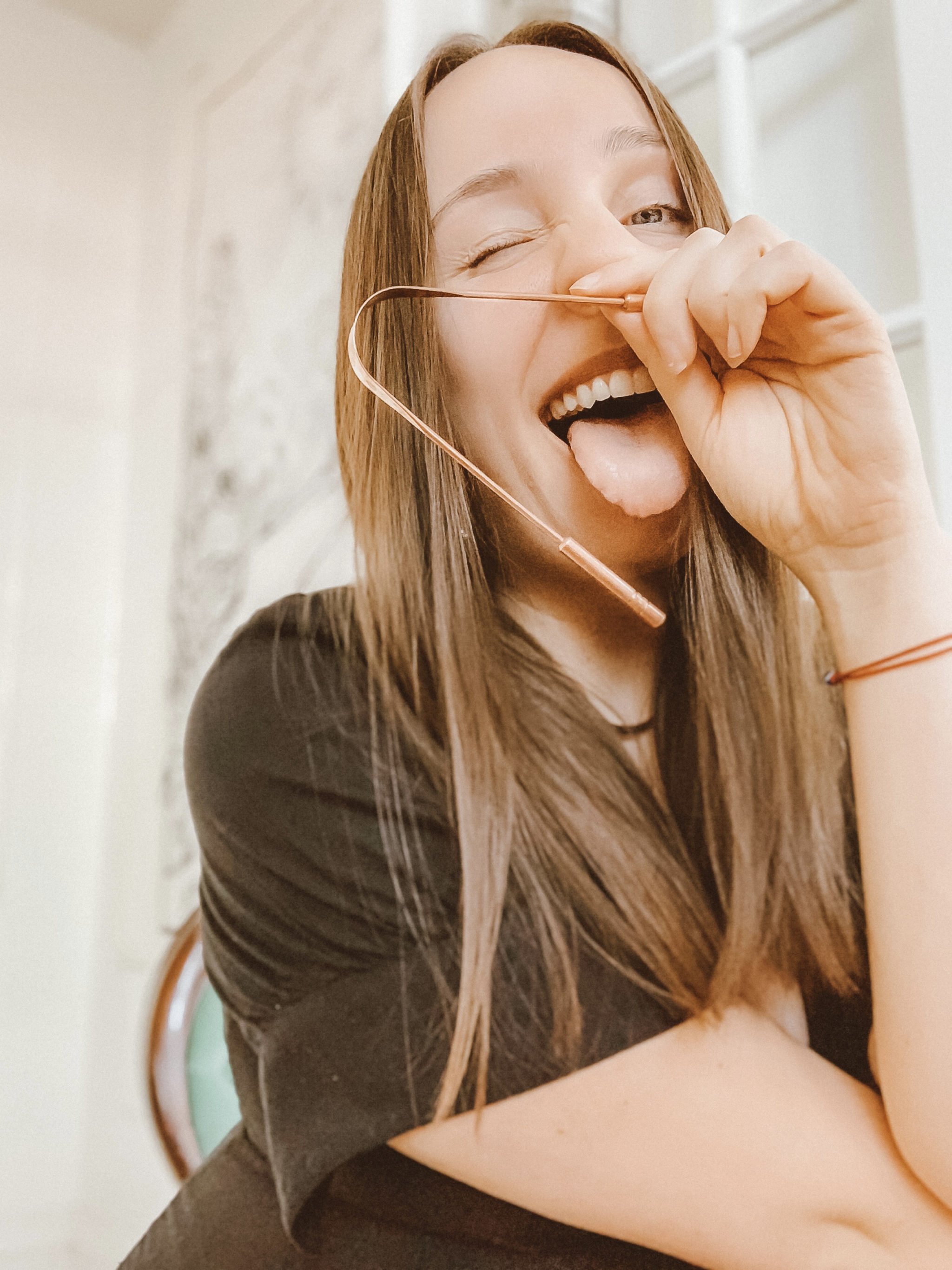 The Surprising Benefits of Tongue Scraping - Lynn Hazan